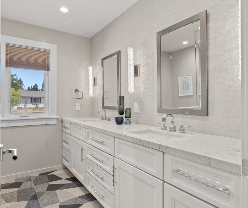 Marble bathroom with freestanding tub and glass shower
